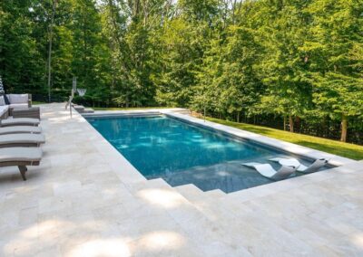 Pera Cream sandblasted installed around pool