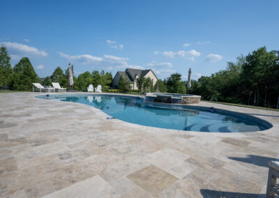 Philly travertine pool patio angled view