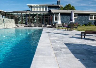 arctic gray coping installed near pool