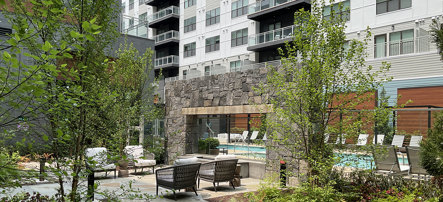 Stone veneer fireplace in an apartment complex courtyard